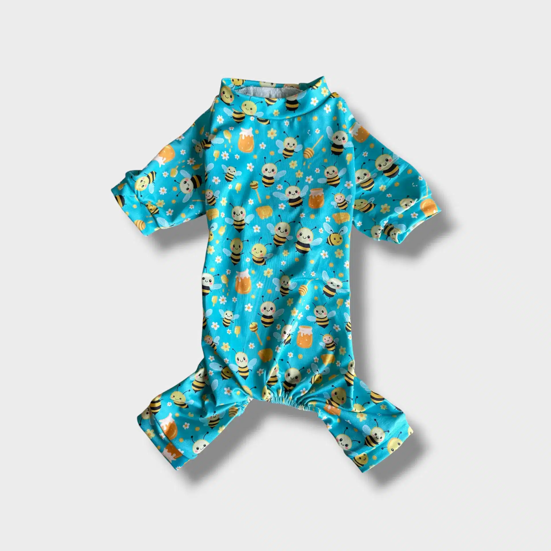 Light blue pet pyjamas with bee pattern, back length 30cm, shown on model